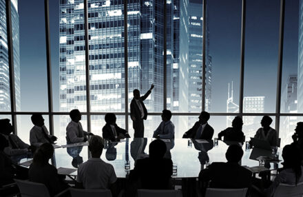 Business people in a board room meeting